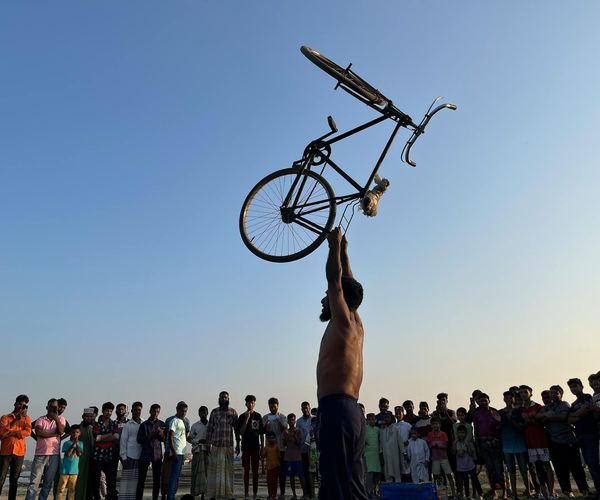 Man performing a balanced exercise showing strength and focus.
